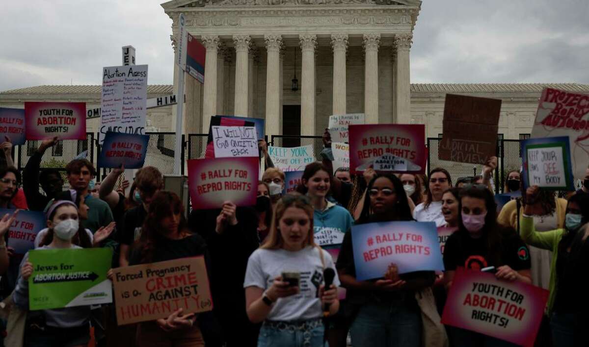 Abortion rights supporters rally Thursday in front of the U.S. Supreme Court in Washington after the leak of a draft memo on Roe v. Wade.