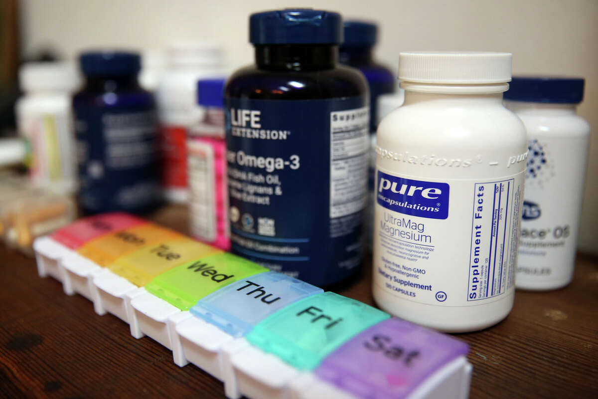 A shelf of vitamins and supplements that Shelley Hayden takes to help combat post-COVID symptoms in Sonoma, Calif. on Thursday, April 14, 2022. 