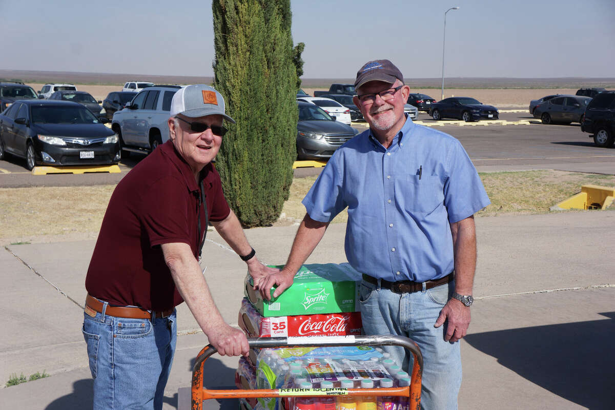 Charles Thomas, left, and Mark Nicholas deliver drinks for officer appreciation this past week. 