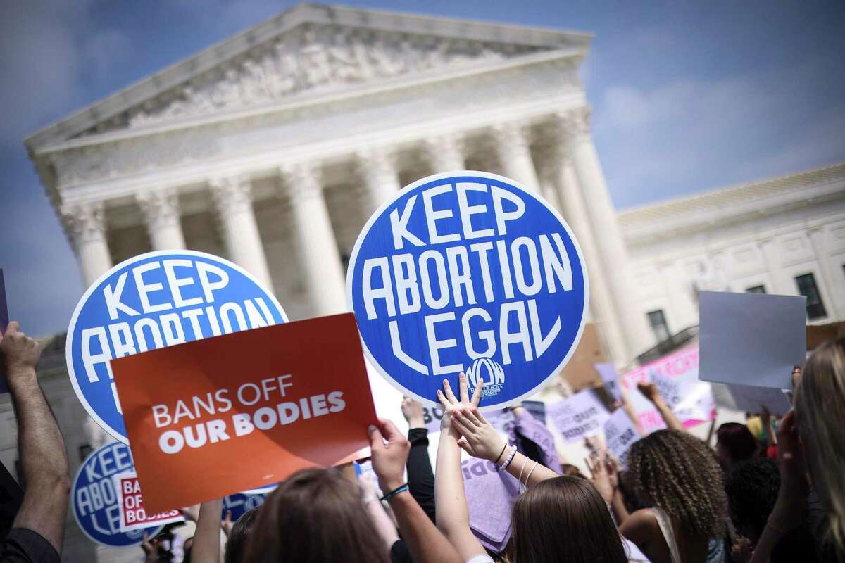 Pro-choice and anti-abortion activists demonstrate in front of the Supreme Court Building on Tuesday, May 3, 2022, in Washington, D.C.