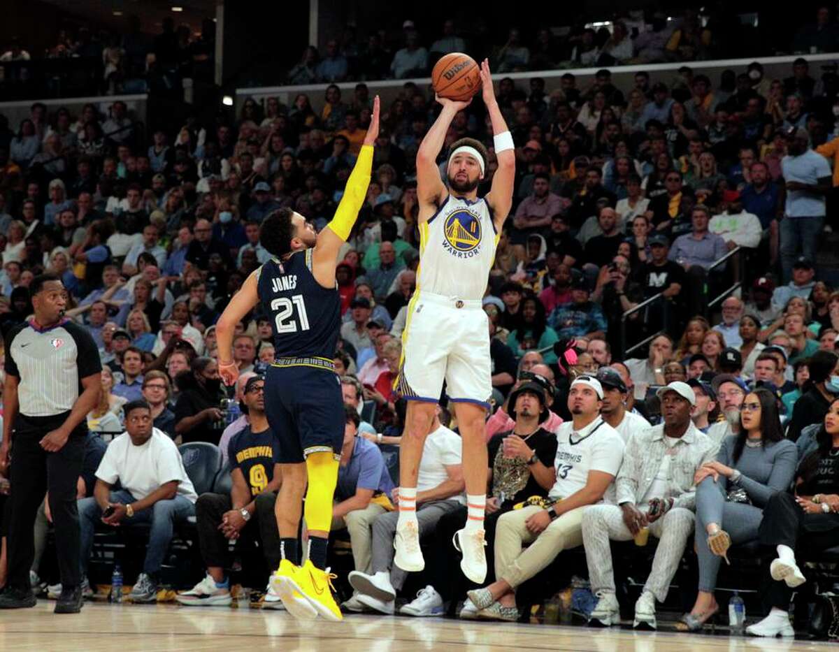 Klay Thompson (11) puts up a three point shot In the first half as the Golden State Warriors played the Memphis Grizzlies in Game 2 of the second round of the NBA Playoffs at Fedex Forum in Memphis, Tenn., on Tuesday, May 3, 2022.