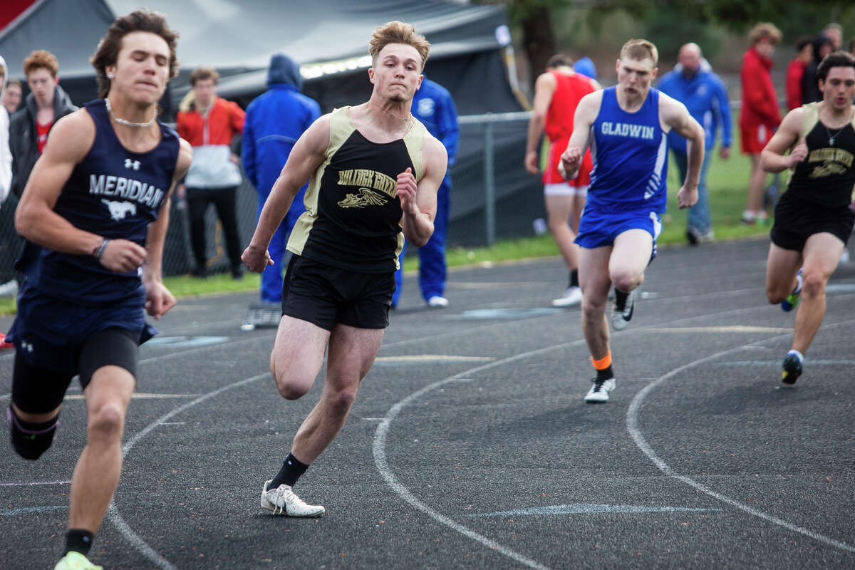Bullock Creek's Kale Snyder competes in the 200 meter dash during a track and field meet Friday, May 6, 2022 at Meridian Early College High School.