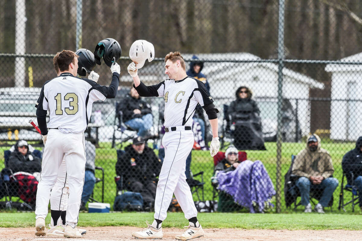 Bullock Creek's Carter Campau celebrates a home run with teammate Parker Grzegorczyk during a game against Ithaca Friday, May 6, 2022 at Bullock Creek High School.