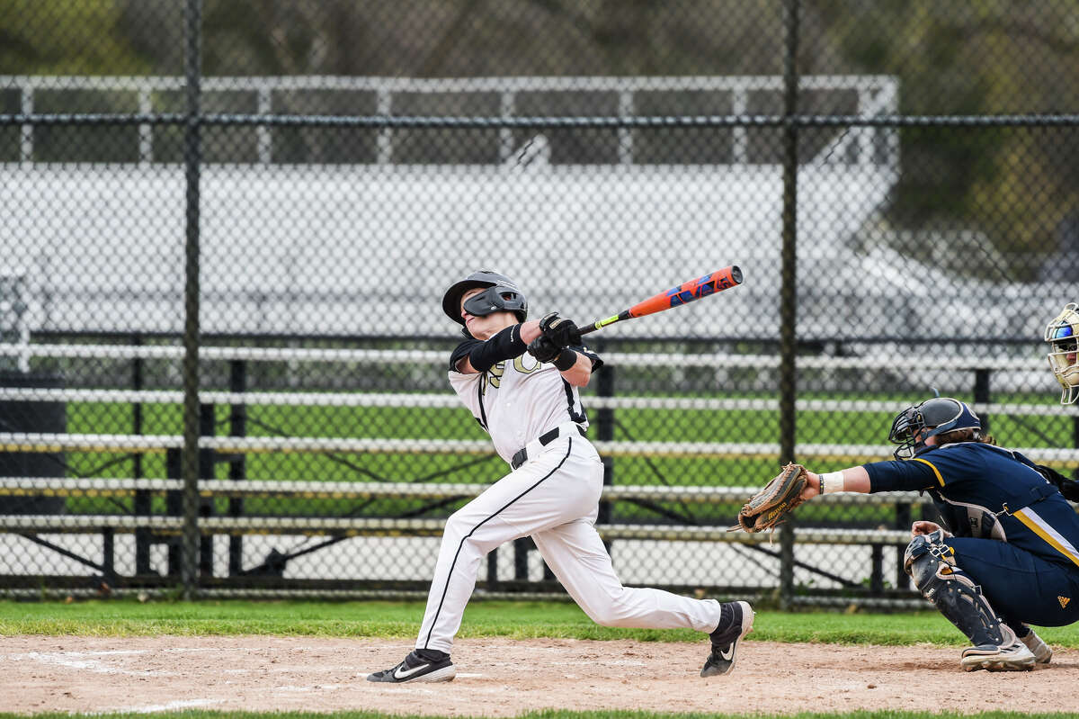 Bullock Creek's Nathan Masar swings on a pitch during a game against Ithaca Friday, May 6, 2022 at Bullock Creek High School.