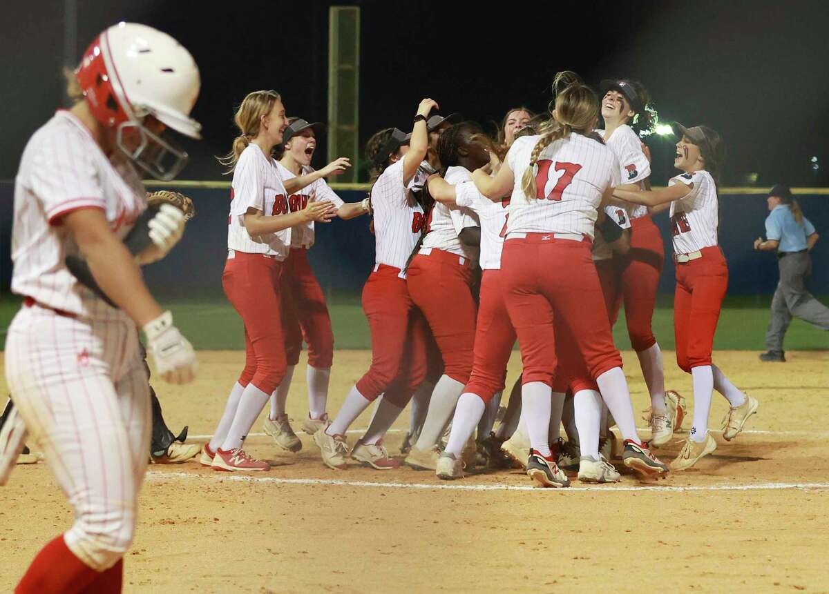 The Austin Bowie softball team erupts after getting the final out against Judson in the second-round 6A second-round softball playoff game at Clemens High School on Friday, May 6, 2022. Judson lost to Bowie, 2-4, to conclude their playoff run.