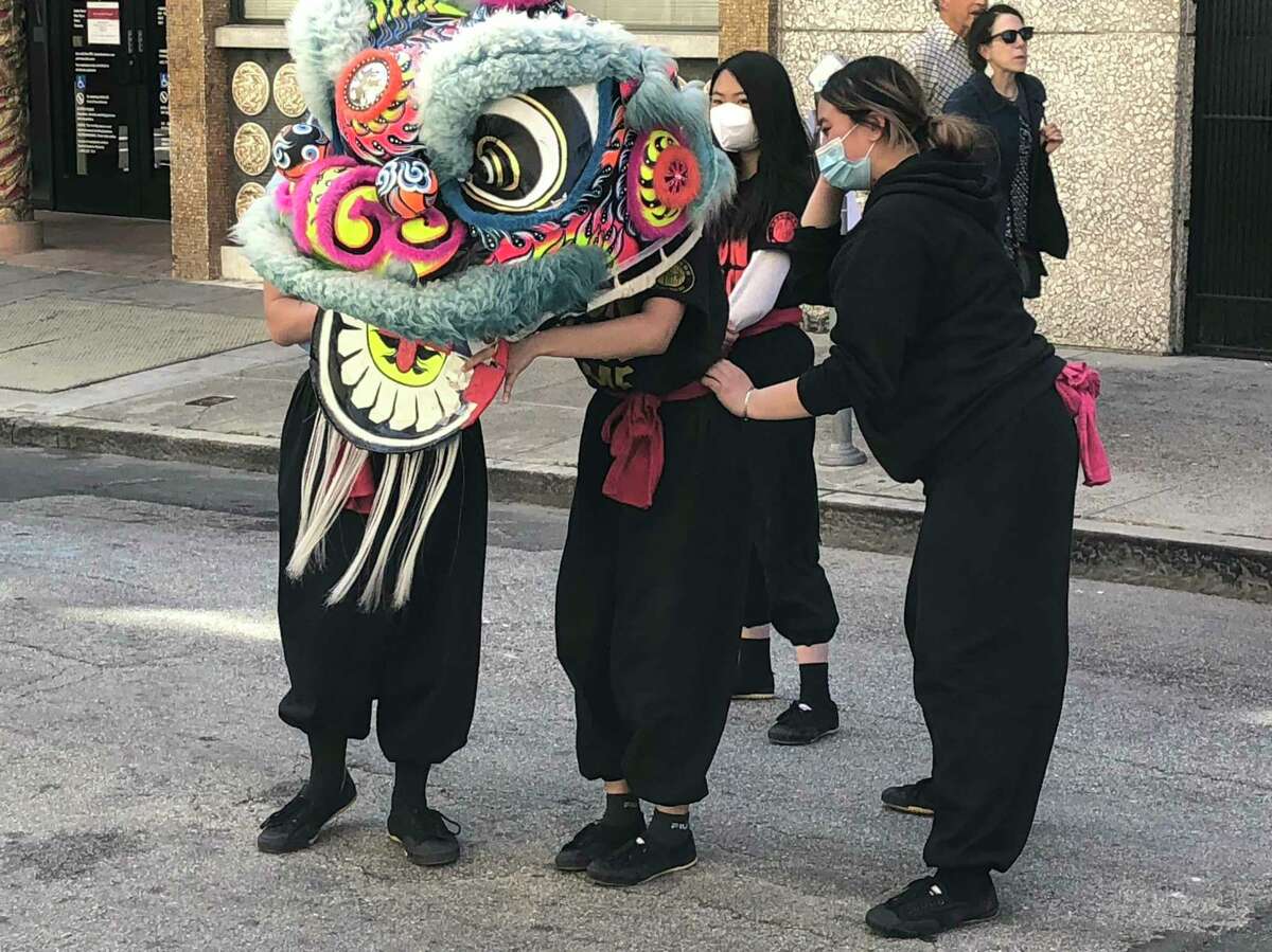 Lion dancers provide local color in Chinatown.