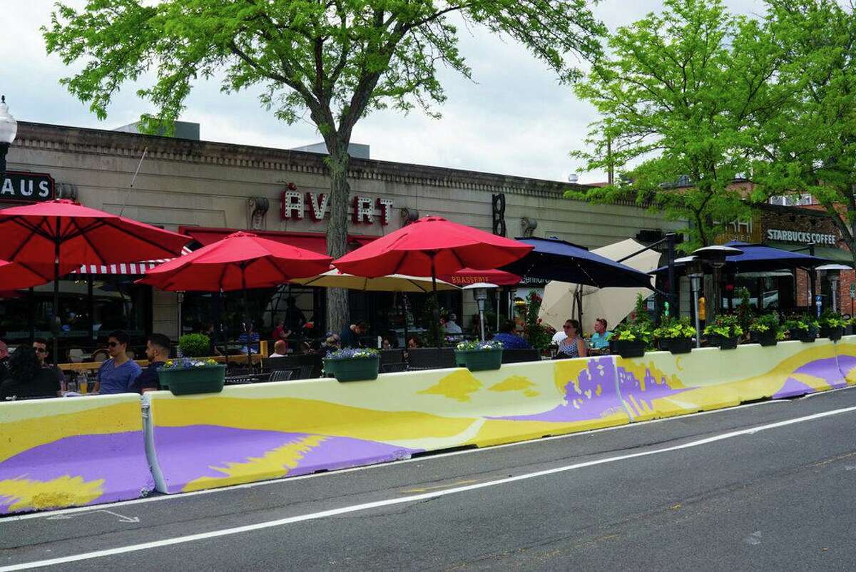 A barrier last year outside of Union Kitchen, Wurst Haus and Àvert Brasserie was painted by Christy Corey.