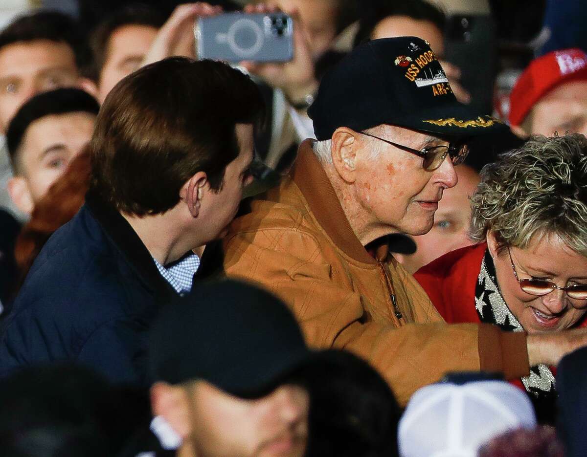 Former Montgomery County Republican Party Chairman Wally Wilkerson stand as former President Donald Trump mentions him at a Save America Rally, Saturday, Jan. 29, 2022, in Conroe.
