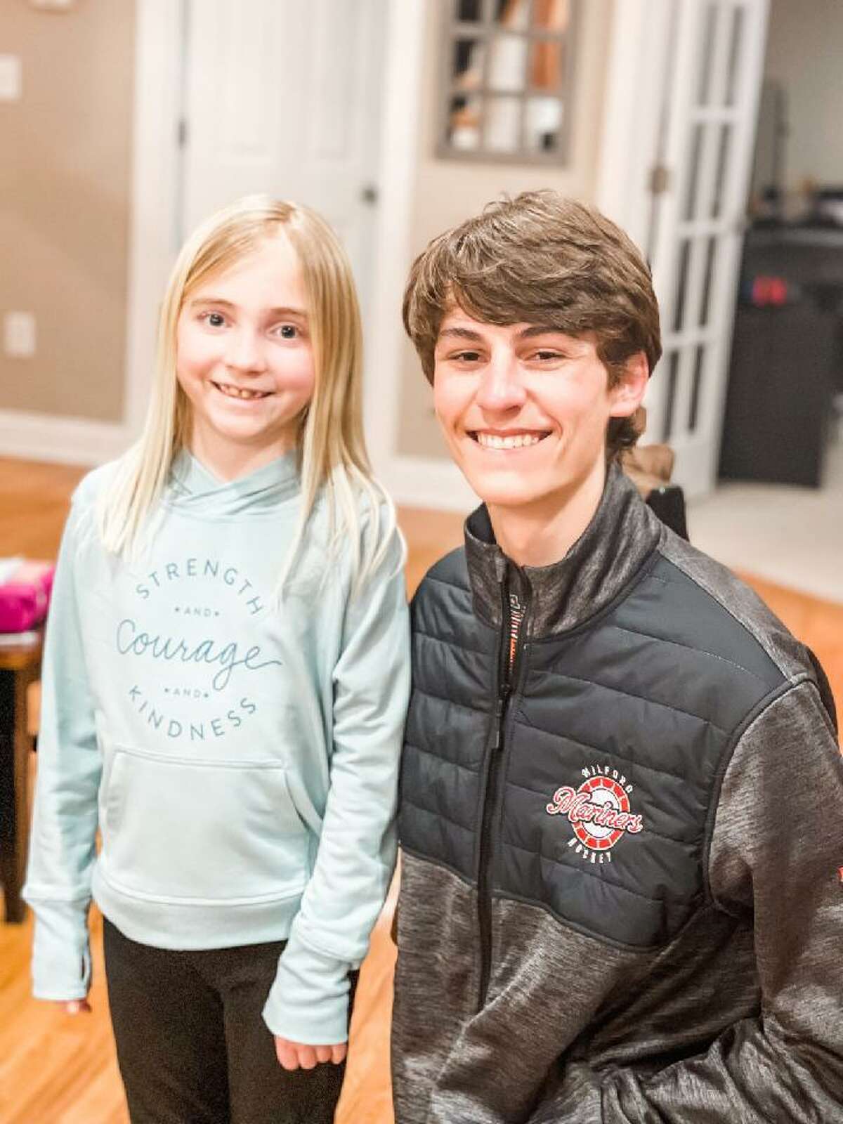 Foran’s Joey Honcz, right, with Avery Lafferty, age 9, who was recently diagnosed with a brain tumor. “Joey has been great with Avery,” says his mother, Christina. “... There was a walk in her honor, The Cure Starts Now, and he came afterward to the house to spend time with her.