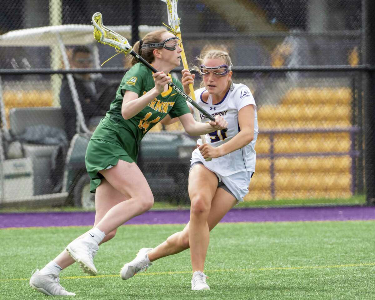 Vermont fifth year student and Guilderland graduate Kerry Gerety makes a move in front of UAlbany junior MacKenzie Beam during the America East Championship at John Fallon Field on the UAlbany campus on Saturday, May 7, 2022. (Jim Franco/Special to the Times Union)