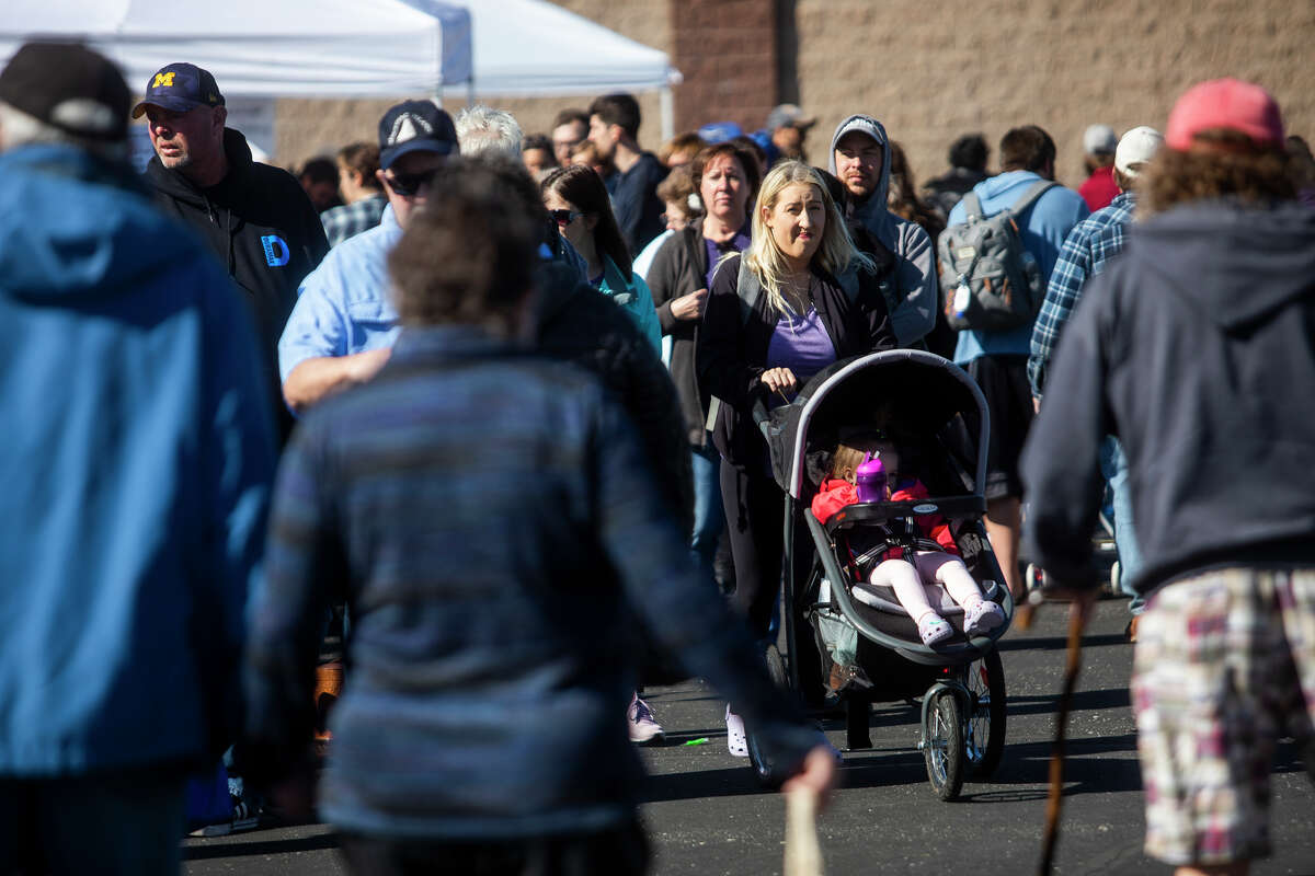 Visitors experience a wide variety of vendors on opening day of the Midland Farmers Market on Saturday, May 7, 2022 at Dow Diamond.