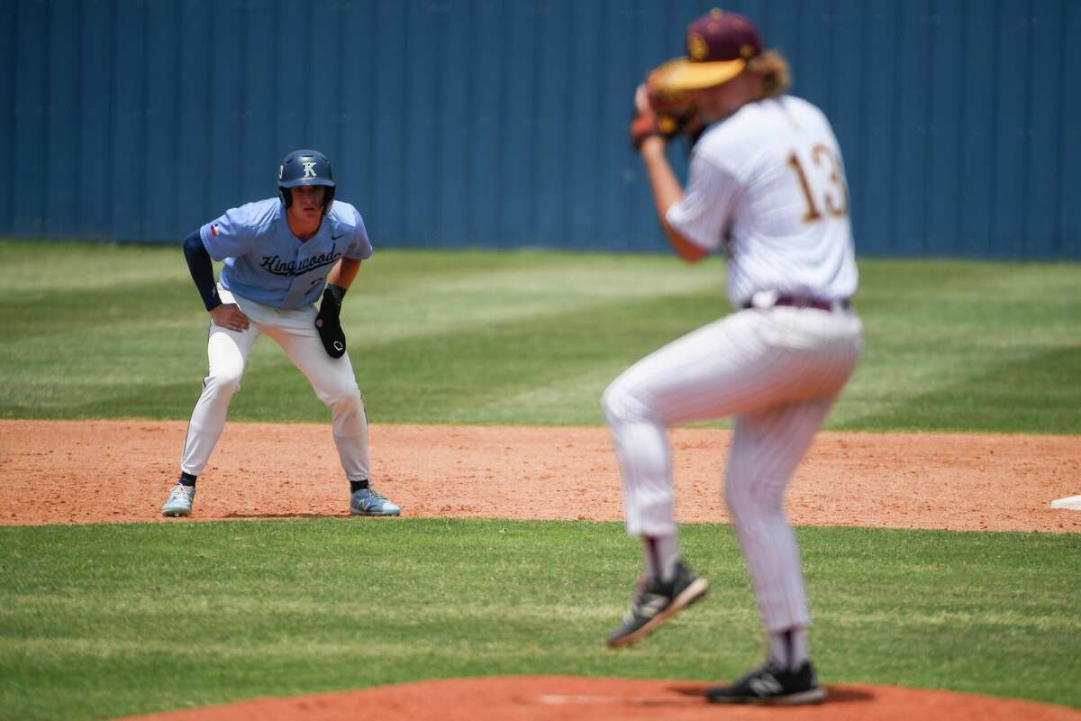 Kingwood's Jack Bruckbauer (2) leads off from second while Deer Park's Hayden Tronson (13) pitches during game 2 of the Region III-6A bi-district baseball playoff at Kingwood High School Saturday, May 7, 2022, in Kingwood, Texas.