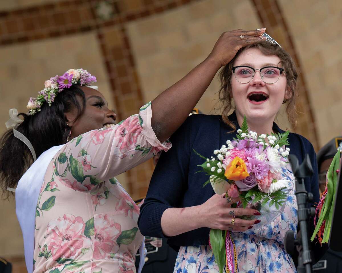 Ashanti Bishop, the 2021 Tulip Queen, crowns Sam Mills as the 2022 Tulip Queen during the 74th Tulip Festival in Washington Park in Albany, NY, on Saturday, May 7, 2022. (Jim Franco/Special to the Times Union)