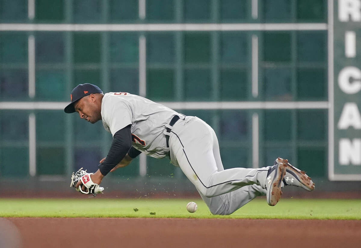 Detroit Tigers second baseman Jonathan Schoop (7) tries to field Houston Astros single Jeremy Pena's during the seventh inning of an MLB baseball game at Minute Maid Park on Saturday, May 7, 2022 in Houston.