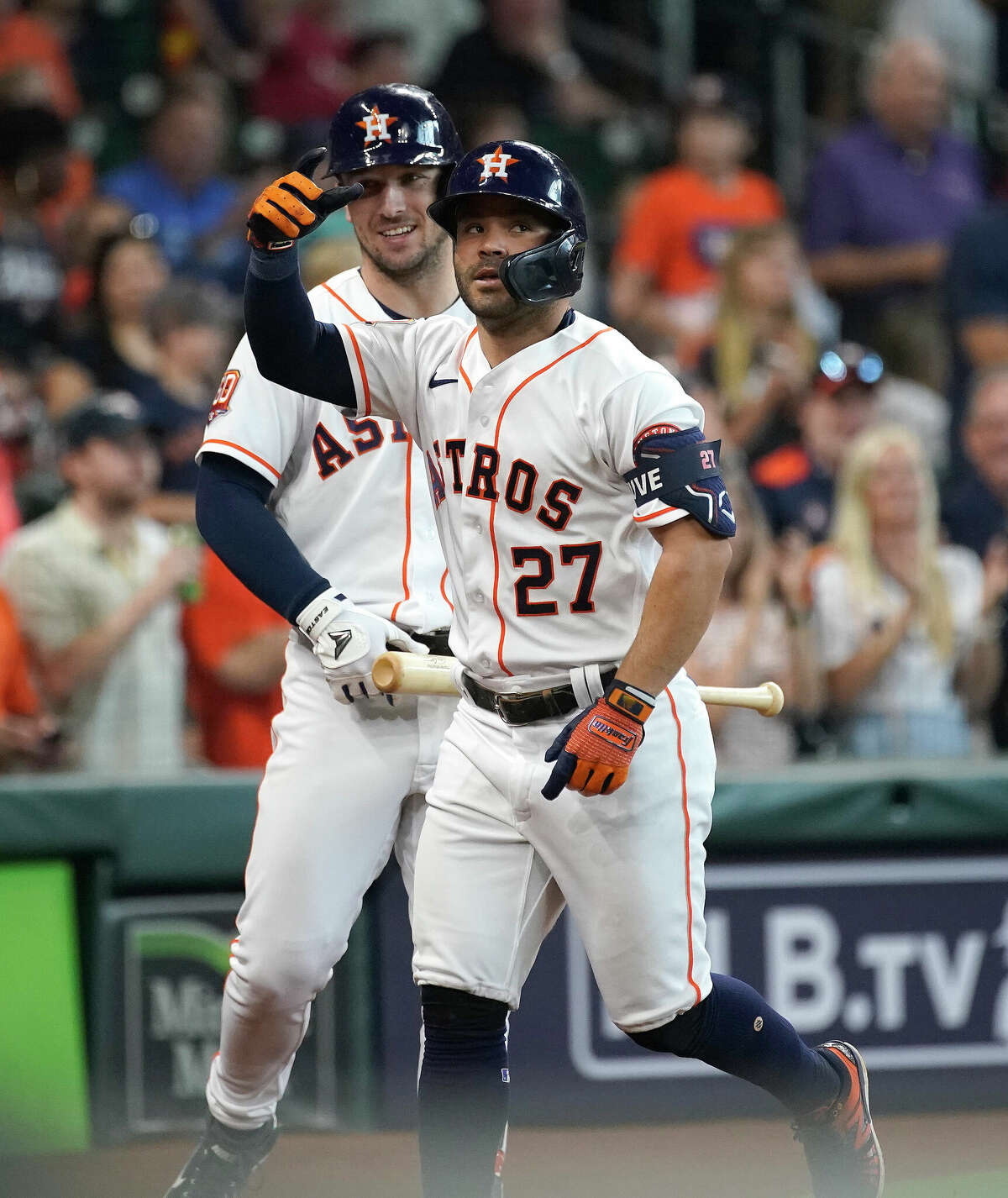 Houston Astros Jose Altuve (27) celebrates with Alex Bregman after hitting a home run against Detroit Tigers starting pitcher Eduardo Rodriguez during the third inning of an MLB baseball game at Minute Maid Park on Saturday, May 7, 2022 in Houston.