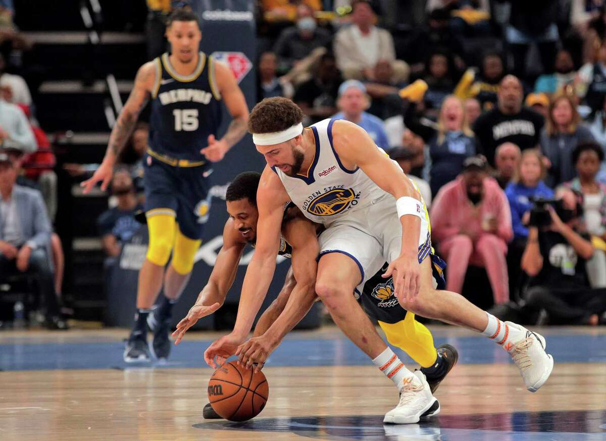 Warriors’ mission in Game 3 is to get Klay Thompson on track. Klay Thompson (11) scrambles for a loose ball against De’Anthony Melton (0) in the fourth quarter as the Golden State Warriors lost to the Memphis Grizzlies 106-101 in Game 2 of the second round of the NBA Playoffs at Fedex Forum in Memphis, Tenn., on Tuesday, May 3, 2022.