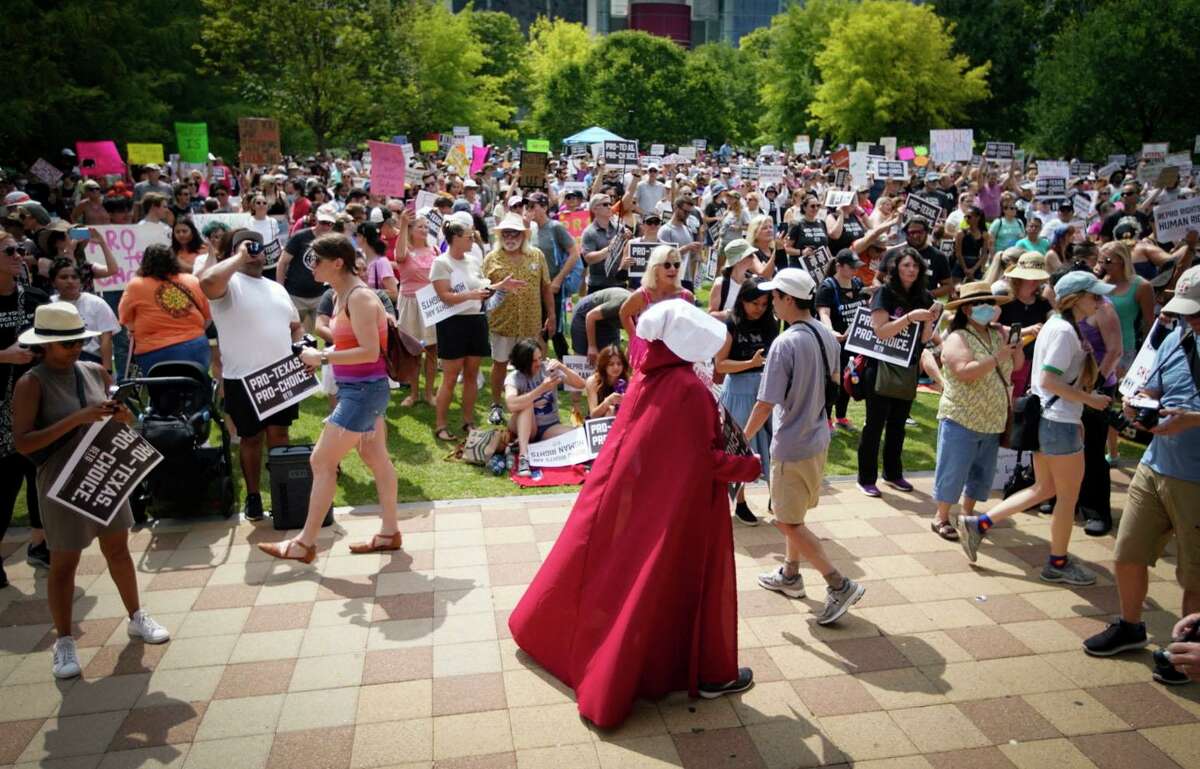 People gather for a rally in support of abortion rights organized by gubernatorial candidate Beto O’Rourke on Saturday, May 7, 2022, at Discovery Green in Houston.