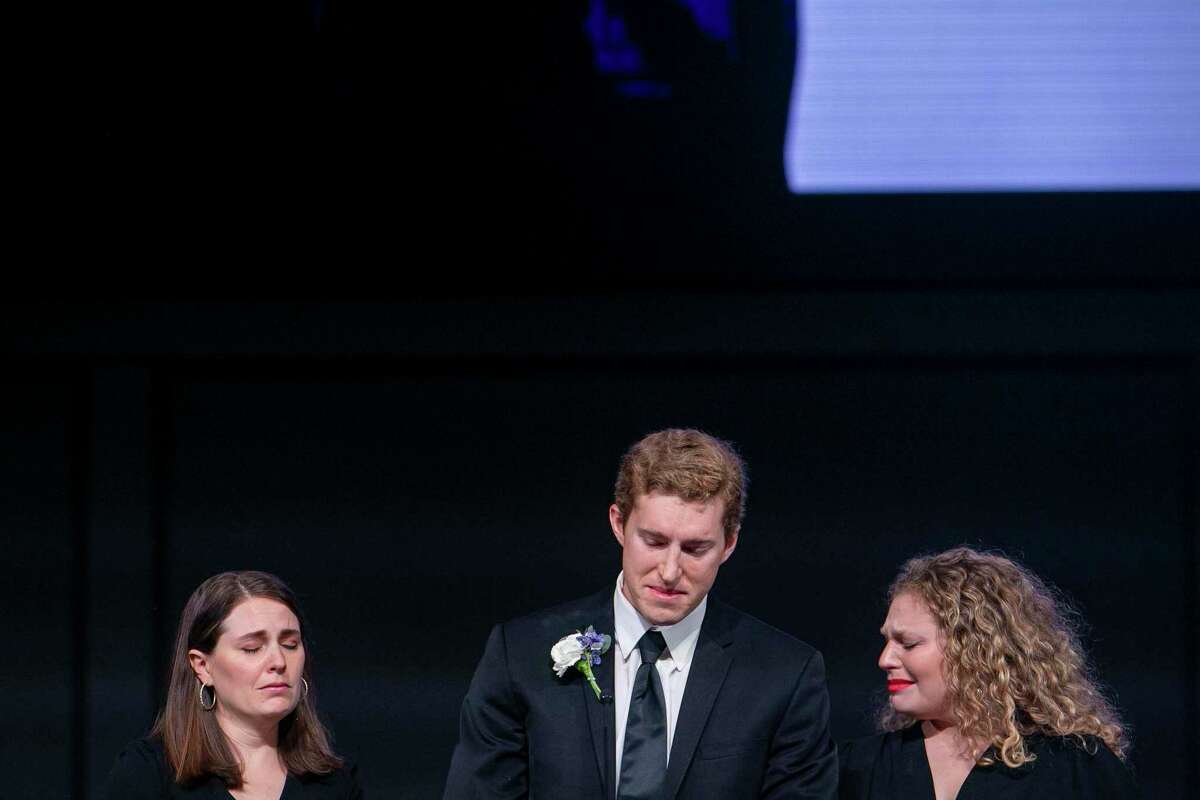 Christian Krueger pauses, overcome with emotion while speaking, as his sisters, Sarah Krueger Robinson, left, and Mariana Krueger, right, tear up at the memorial service for their father at Oakwood Church in New Braunfels on Thursday. Bob Krueger, diplomat and former U.S. senator, died April 30 at 86.