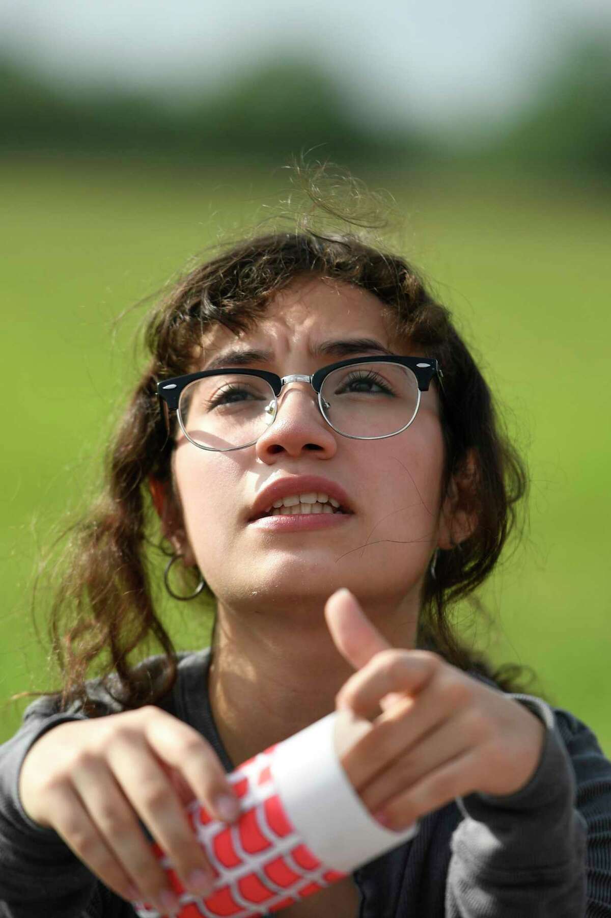Angely Barahona, a student on the César E. Chávez High School rocket team, discusses the mass of their rocket with her teammates at Clear Creek ISD’s Challenger Columbia Stadium Saturday, May 7, 2022, in Webster, Texas.