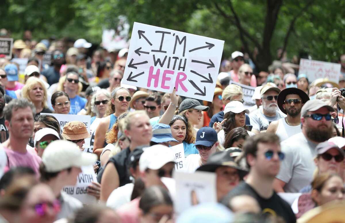 A woman with a sign during an abortion rights rally organized by Beto O’Rourke at Discovery Green on Saturday, May 7, 2022 in Houston.