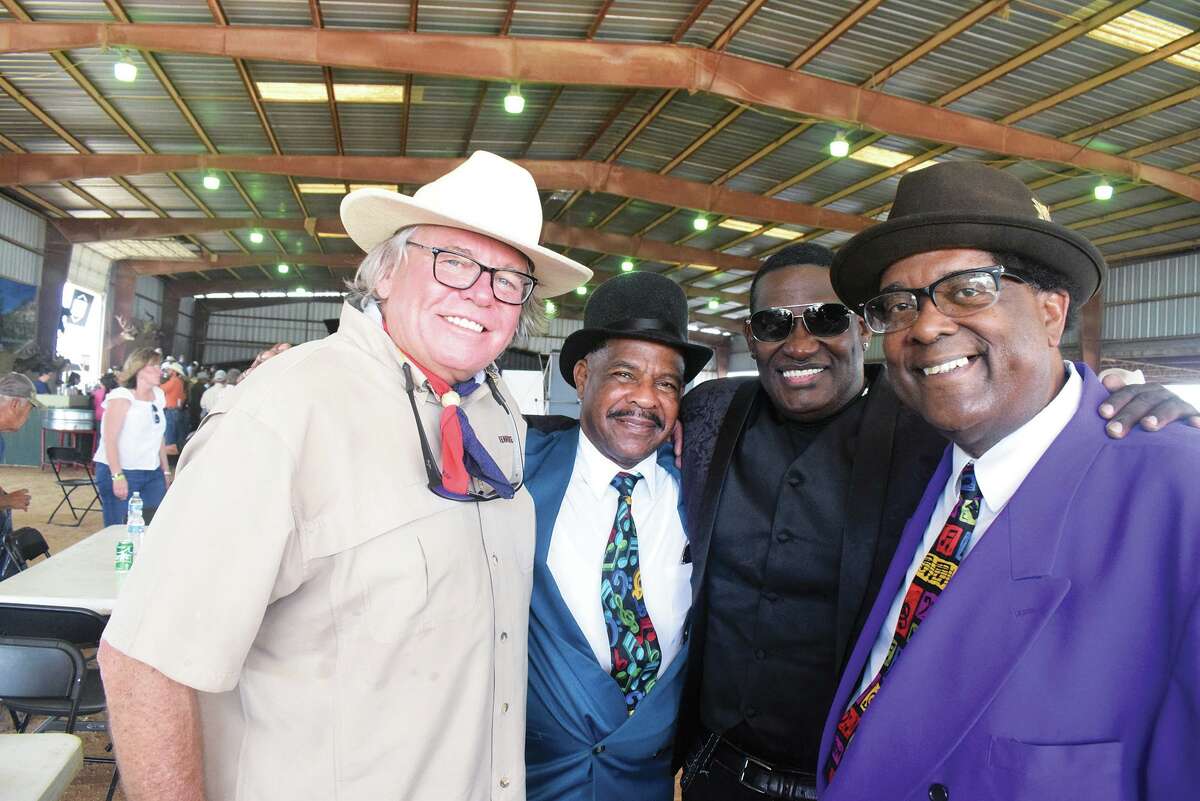 Darren Casey, one of new co-owners of the Y.O. Ranch, hangs out with the a capella singers from New Orleans who sang the national anthem at an auction Saturday, April 30. From left are Casey, Mycartery Groce, Darryl Jenkins and Jerome Alexander.