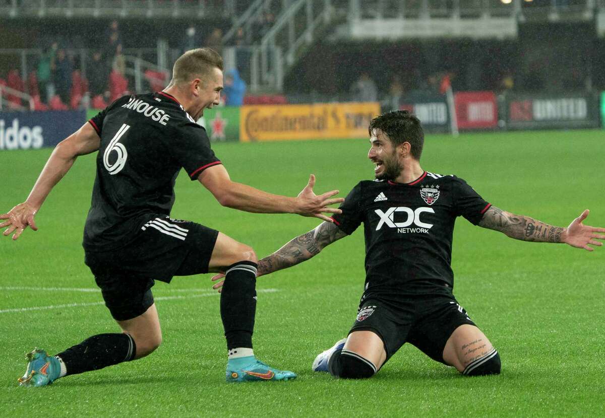 D.C. United forward Taxi Fountas (11) celebrates his first goal with midfielder Russell Canouse (6) during an MLS match between D.C. United and the Houston Dynamo on Saturday, May 7, 2022, at Audi Field, in Washington, D.C.