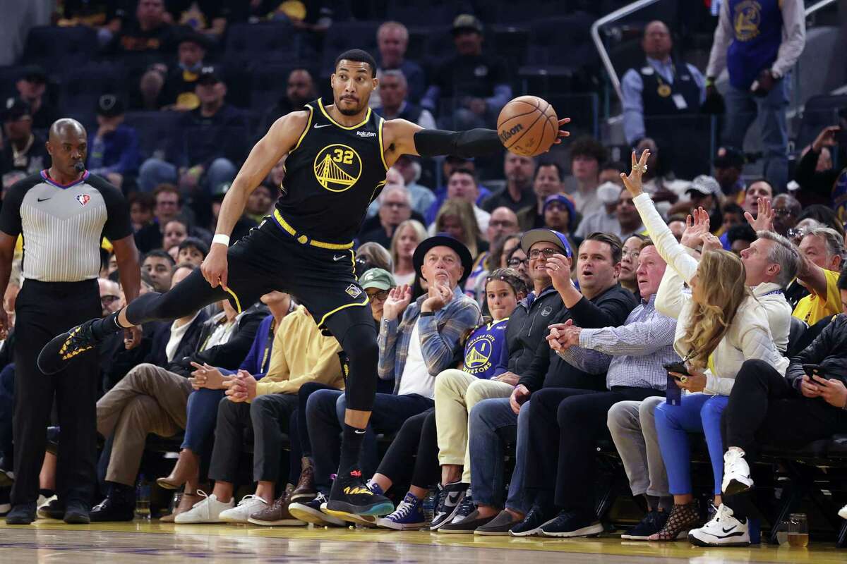 Golden State Warriors’ Otto Porter, Jr. saves the ball from going out of bounds against Memphis Grizzlies during Game 3 of NBA Western Conference Semifinals in San Francisco, Calif., on Saturday, May 7, 2022.