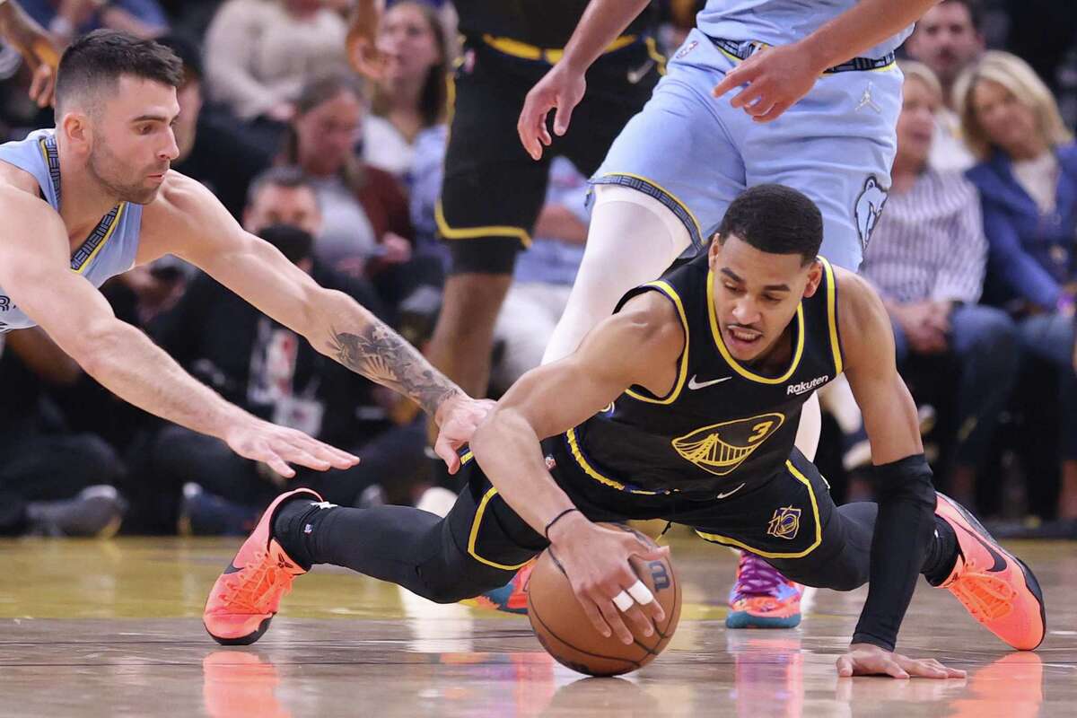 Golden State Warriors’ Jordan Poole grabs loose ball against Memphis Grizzlies’ John Konchar in 1st quarter during Game 3 of NBA Western Conference Semifinals in San Francisco, Calif., on Saturday, May 7, 2022.