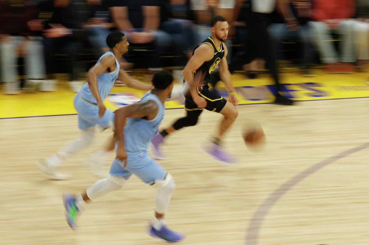 Golden State Warriors' guard Stephen Curry drives the ball during the second quarter in Game 3 of the 2022 NBA Playoffs Western Conference Semifinals against the Memphis Grizzlies at Chase Center in San Francisco, Calif. Saturday, May 7, 2022.