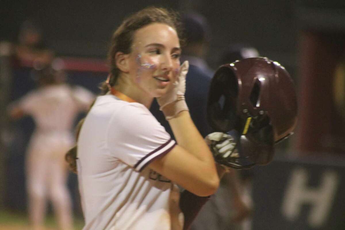 Lindsey McKnight stands on third base after she helped kick off a seven-run fourth inning Saturday night. McKnight was also the one who kept Deer Park's faint pulse going in Game 2 when she singled with two outs in the seventh inning and the team losing 3-2.