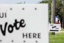Signs are posted outside Brook Hollow Library in San Antonio, Texas, on May 7, 2022. People voted on the city's bond package, two state propositions on property taxes, school district seats and/or bonds and suburban elections.