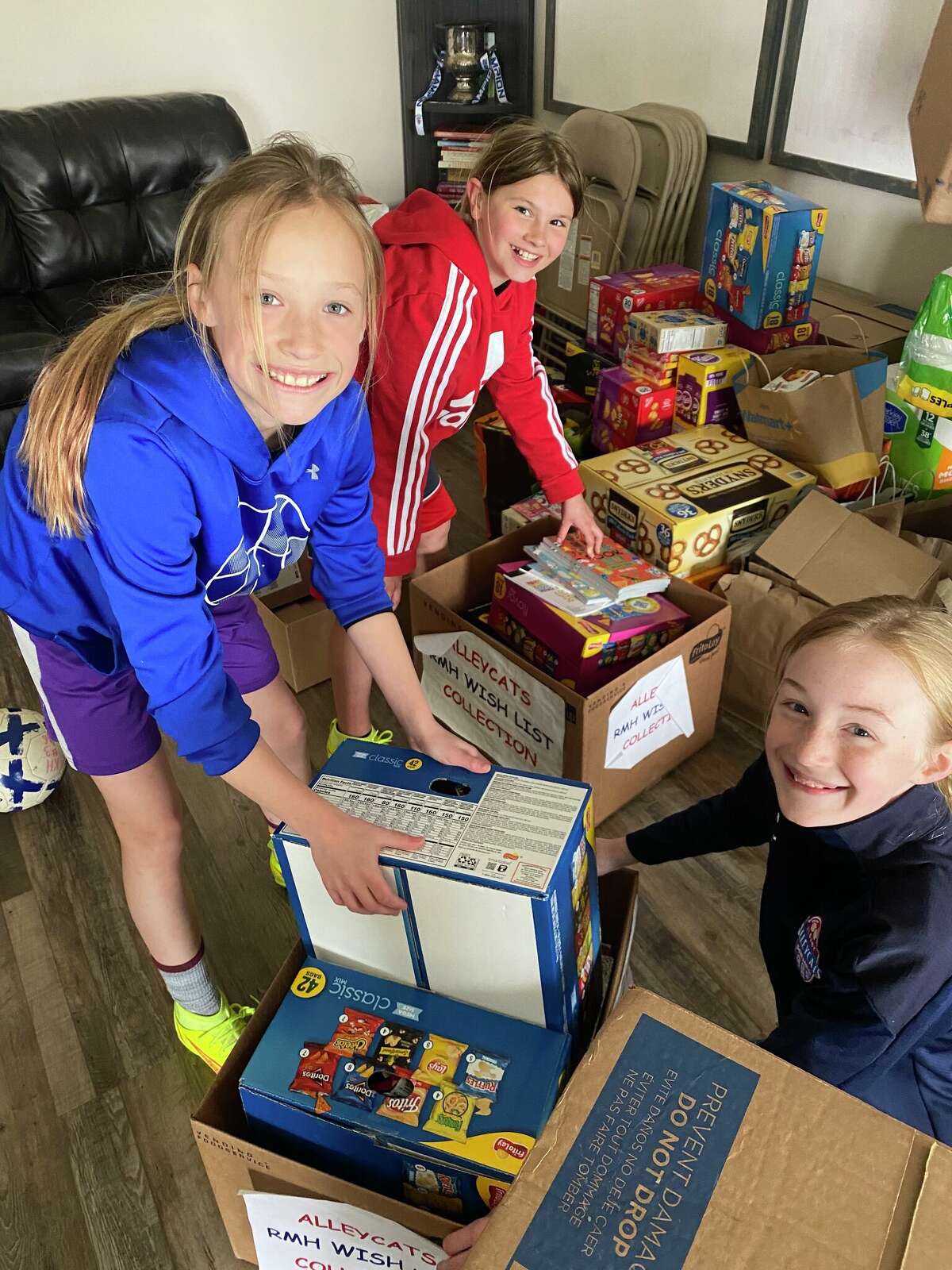 The Albany Alleycats organization collected goods and supplies for the Ronald McDonald House and players and parents dropped off five carloads of supplies to the organization. Above, from left, Maggie Mullin, Kennedy Hovey and Zoey Beesmer participated in the drop-off. The girls were given a tour of the house and learned about the services provided by the organization.