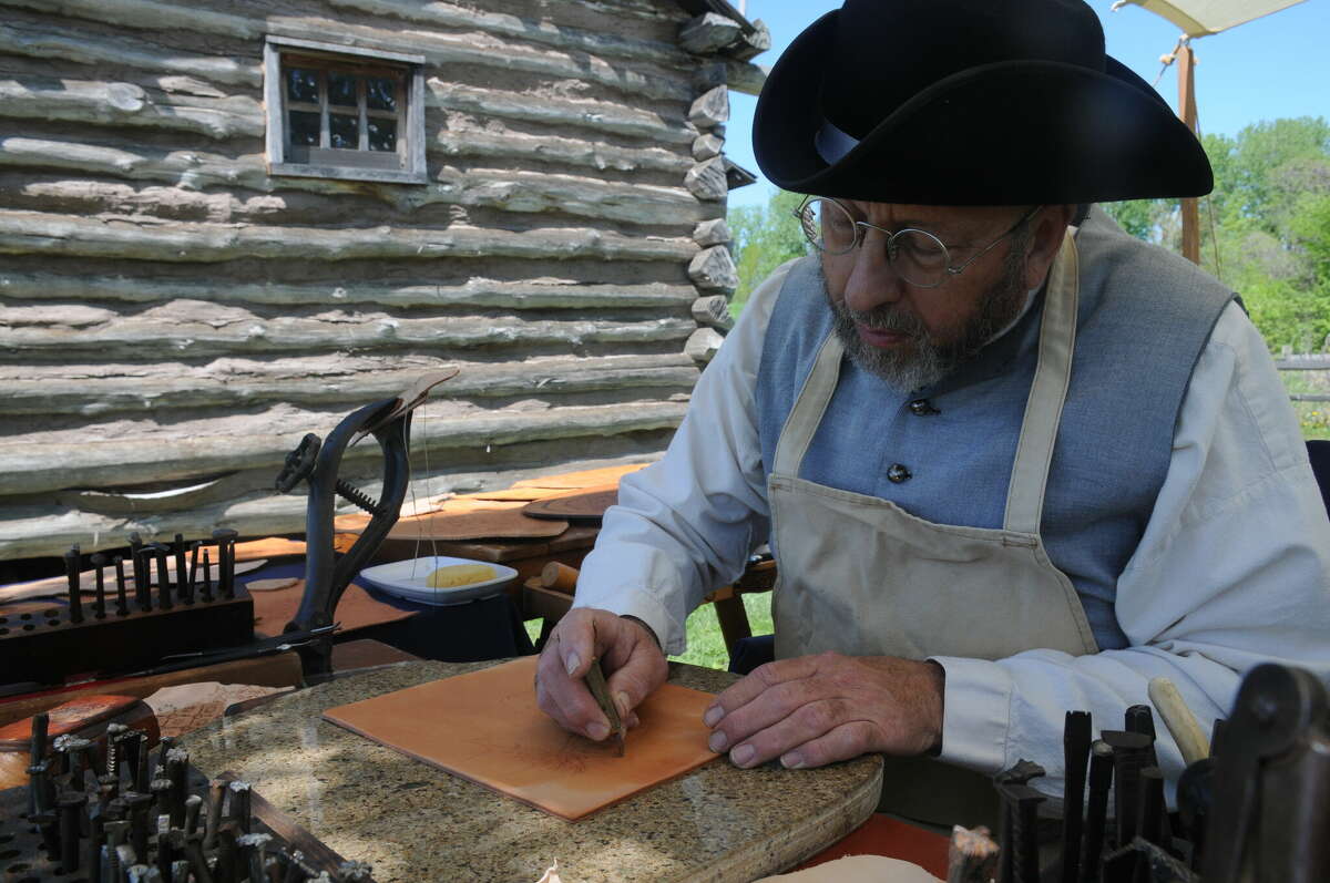 James Mewes makes period leather goods during last weekend's Departure event at Lewis and Clark State Historic Site.   