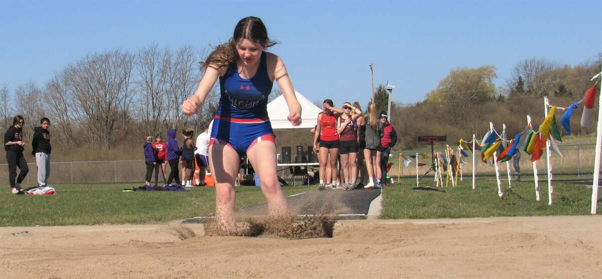 Manistee Catholic Central freshman Holly Riley-Lampinen sticks her landing in the high jump at the 2022 Saber Flash Invitational on Saturday, May 7th at Manistee Community Track. Her jump of 12-feet, 6-inches was a personal record and good enough for sixth place. 