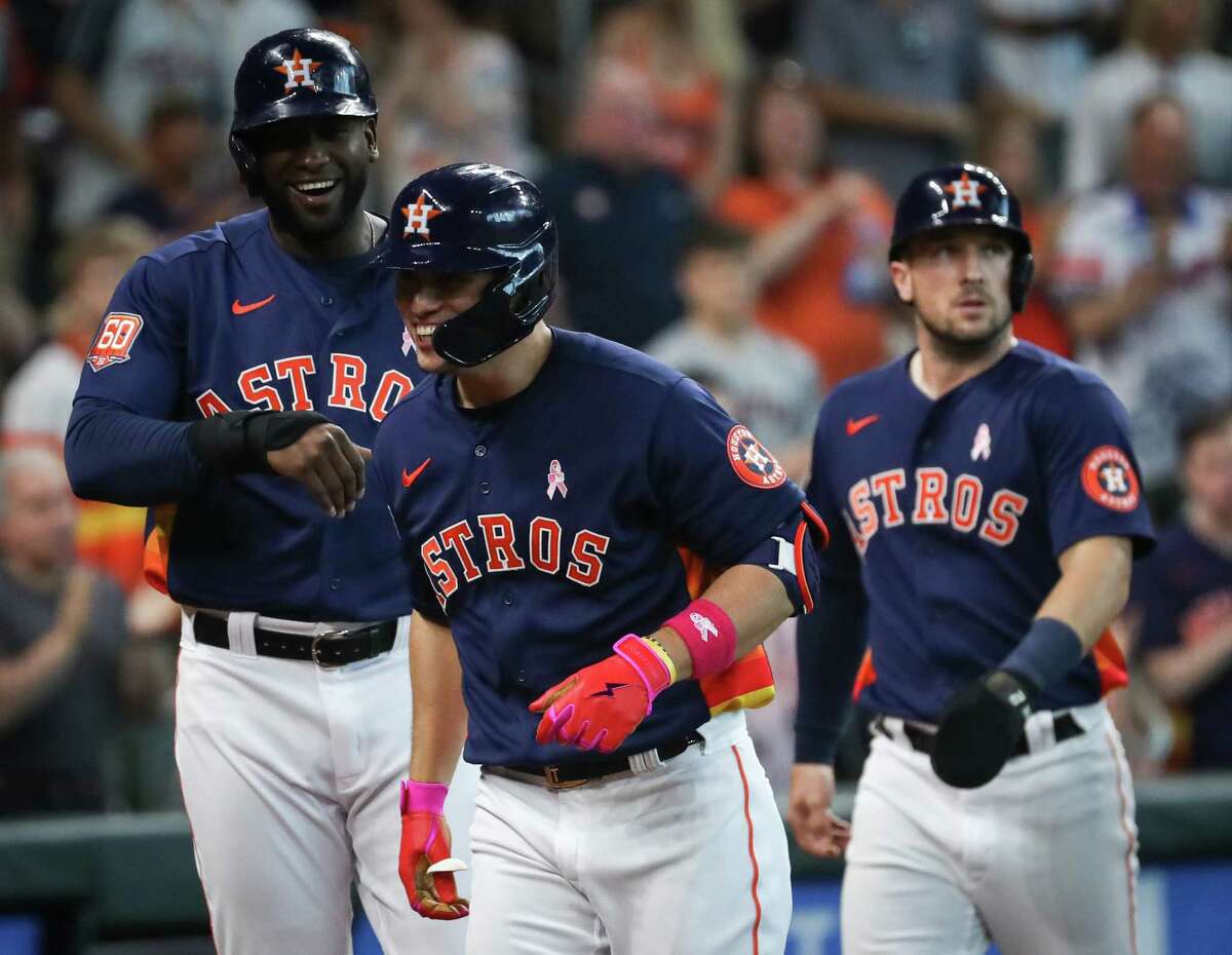 Houston Astros shortstop Aledmys Diaz (16) celebrates his grand slam with designated hitter Yordan Alvarez (44) during the third inning of an MLB game Sunday, May 8, 2022, at Minute Maid Park in Houston.