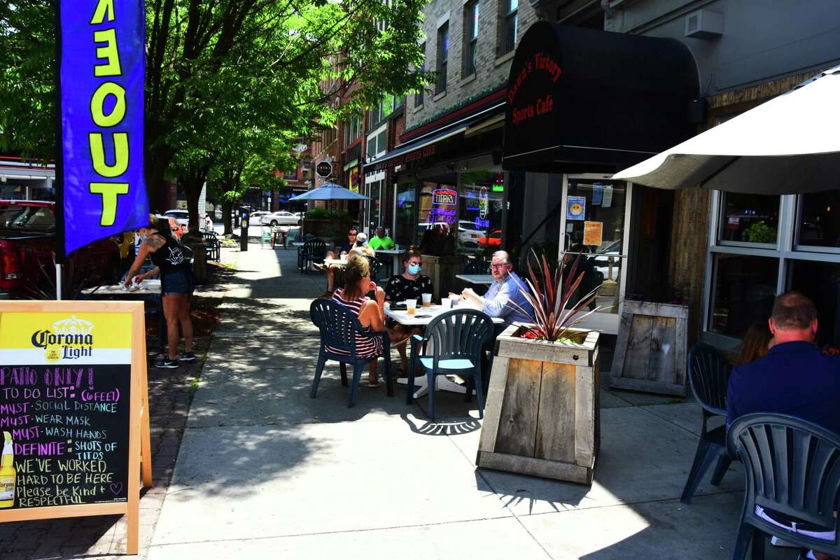 Socially distanced sidewalk tables begin to fill up for lunch at Dawn's Victory Sports Cafe in Albany Thursday, June 4, 2020. (Photo by Steve Barnes/Times Union.)