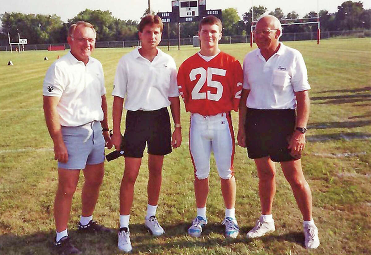 Matthew Conroy, second from right, with, left former Edwardsville assistant football coach Stan Wojcik, former head coach Tim Dougherty and former assistant coach Lloyd Dunne. Conroy was a wide receiver and defensive back on Dougherty’s first two teams at EHS in 1992 and 1993.