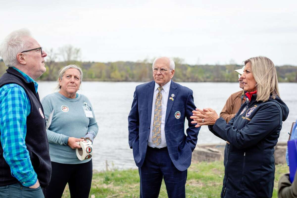 State Sen. Daphne Jordan (right) speaks with residents during a May 7, 2022 rally for waterfront access in Castelton-on-Hudson as Congressman Paul Tonko (center) looks on.