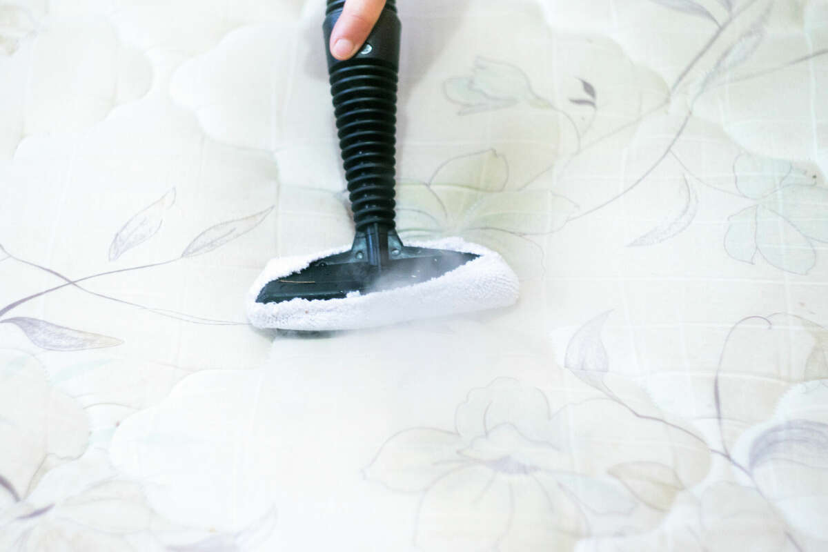 Mattress cleaning with steam cleaner
