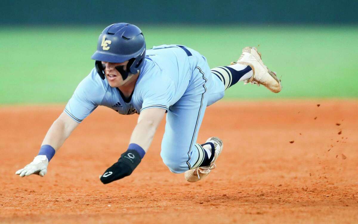 Ethan Davis #8 of Lake Creek dives into third base after advancing from first on Samson Pugh’s single in the fourth inning of Game 1 of a Region II-6A high school baseball bi-district playoff series at Lake Creek High School, Friday, May 6, 2022, in Montgomery.