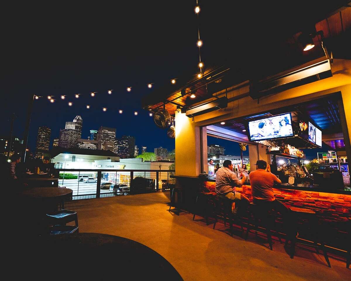 This Dogwood's spacious rooftop bar faces Houston's downtown skyline.