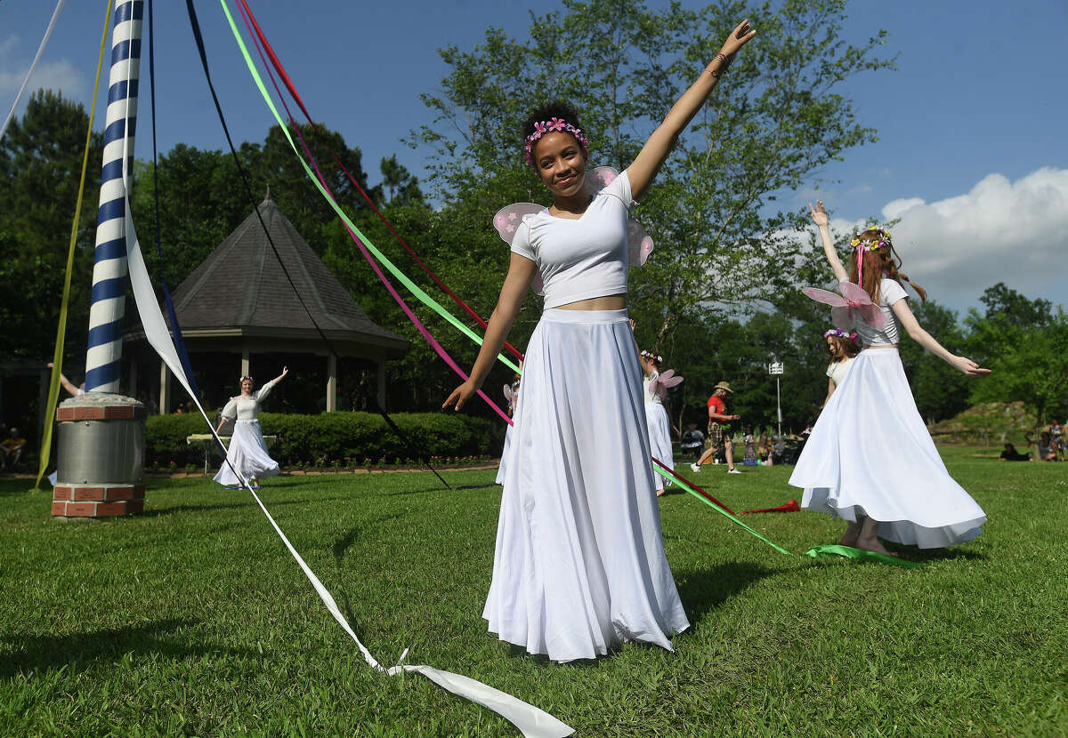 Dancers wrap the maypole in traditional fashion during the annual Maypole Festival in Tyrrell Park Saturday. Photo made Saturday, May 7, 2022. Kim Brent/The Enterprise