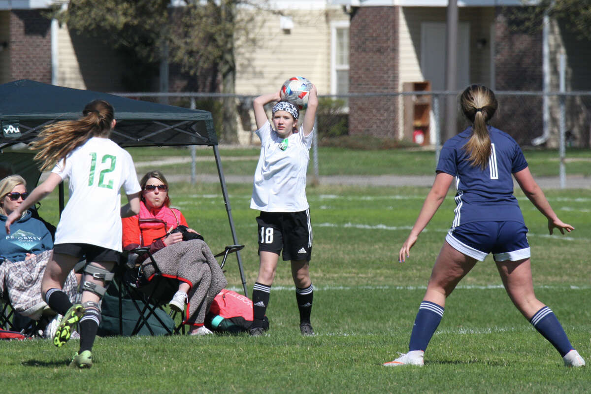 Midland Fusion's Evie Baldwin takes a throw-in while playing in the 39th annual Midland Invitational Tournament Saturday, May 9, 2022 at the Midland Soccer Club.