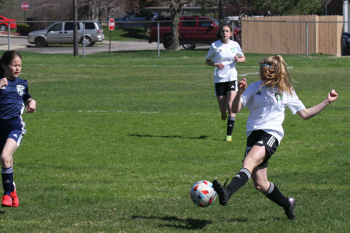 Midland Fusion's Kaitlin Sharp dribbles the ball while playing in the 39th annual Midland Invitational Tournament Saturday, May 9, 2022 at the Midland Soccer Club.