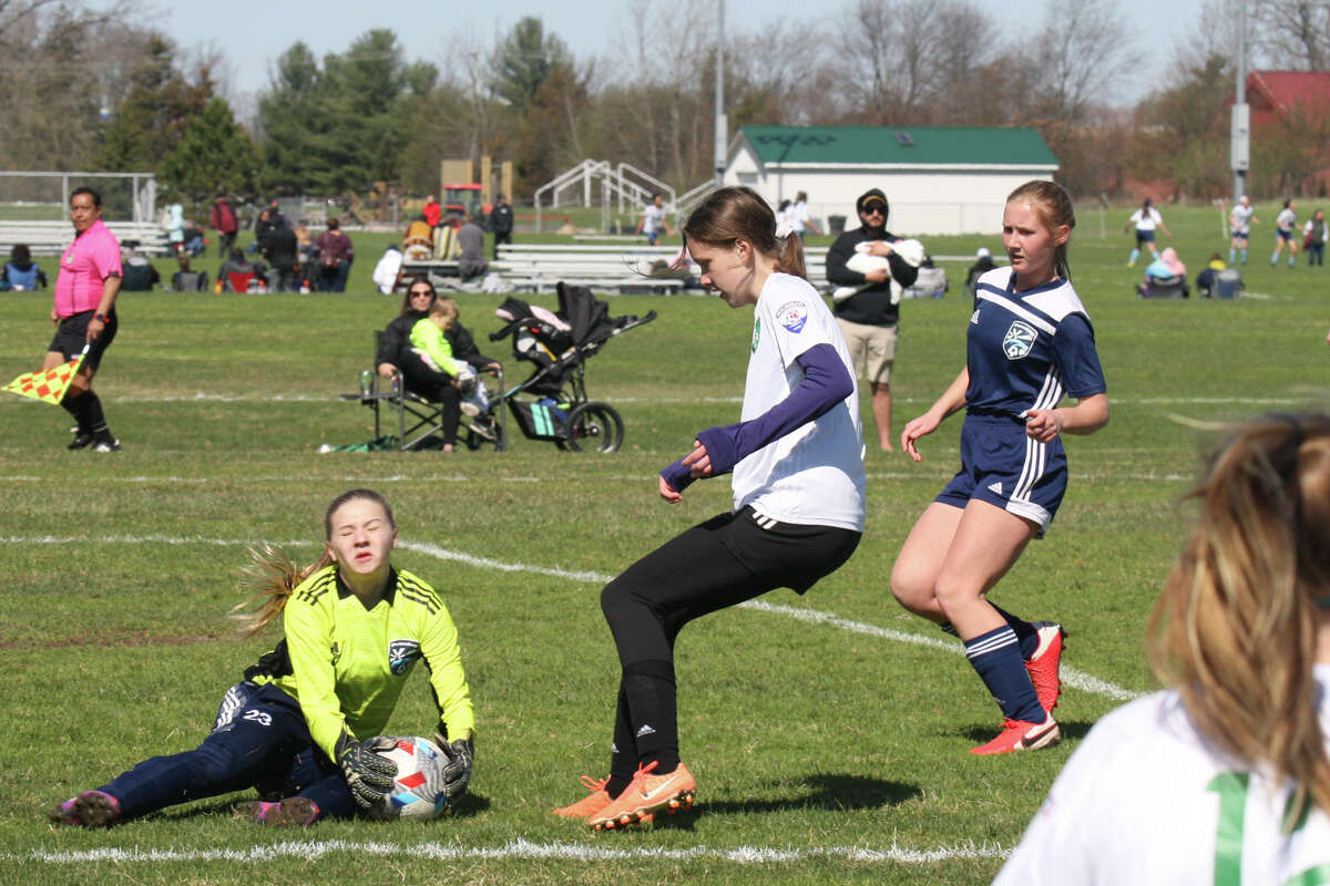 Midland Fusion's Grace Goodell takes a shot on goal while playing in the 39th annual Midland Invitational Tournament Saturday, May 9, 2022 at the Midland Soccer Club.