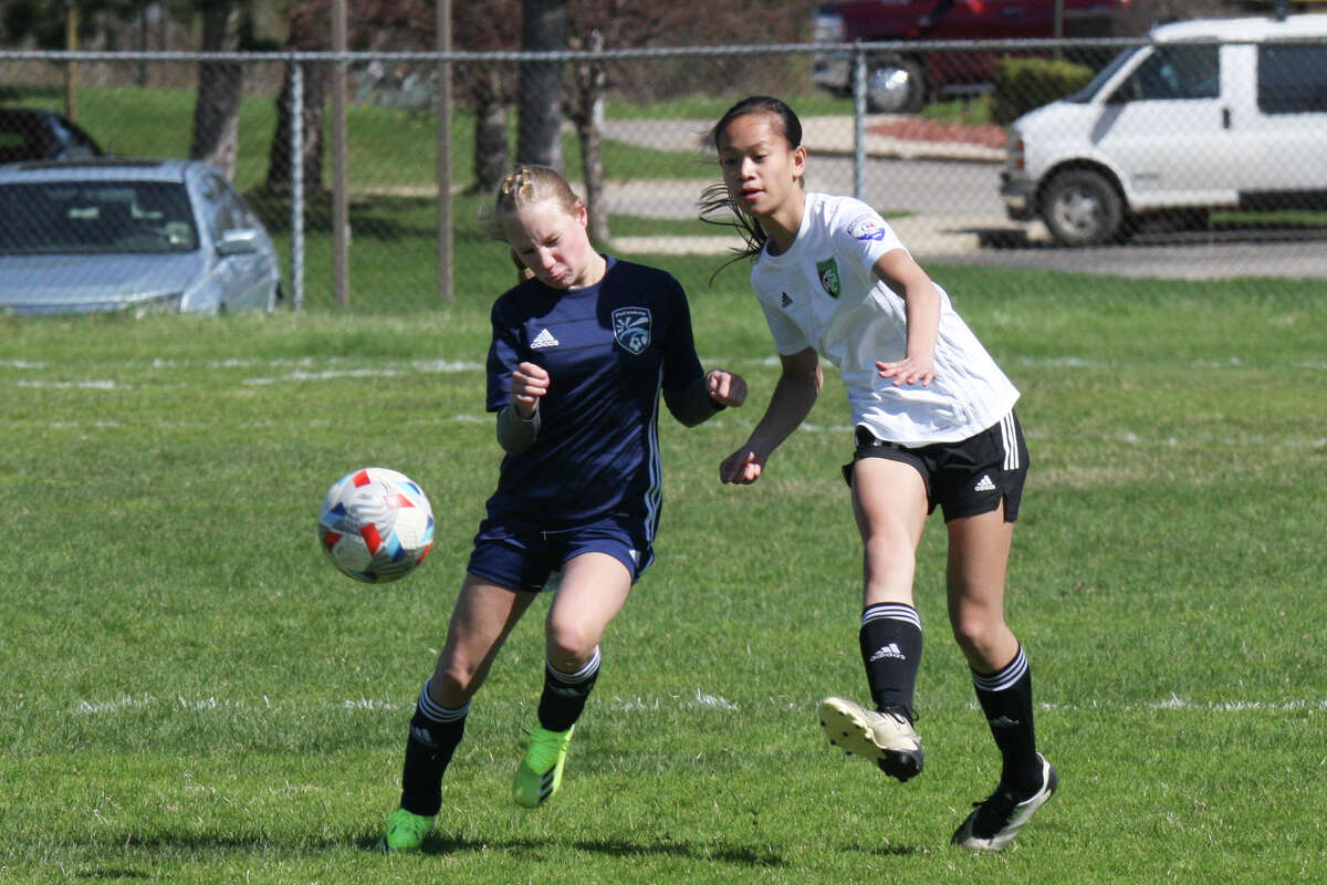 Midland Fusion's Grace Ellis-Hutchings sends the ball down the field while playing in the 39th annual Midland Invitational Tournament Saturday, May 9, 2022 at the Midland Soccer Club.