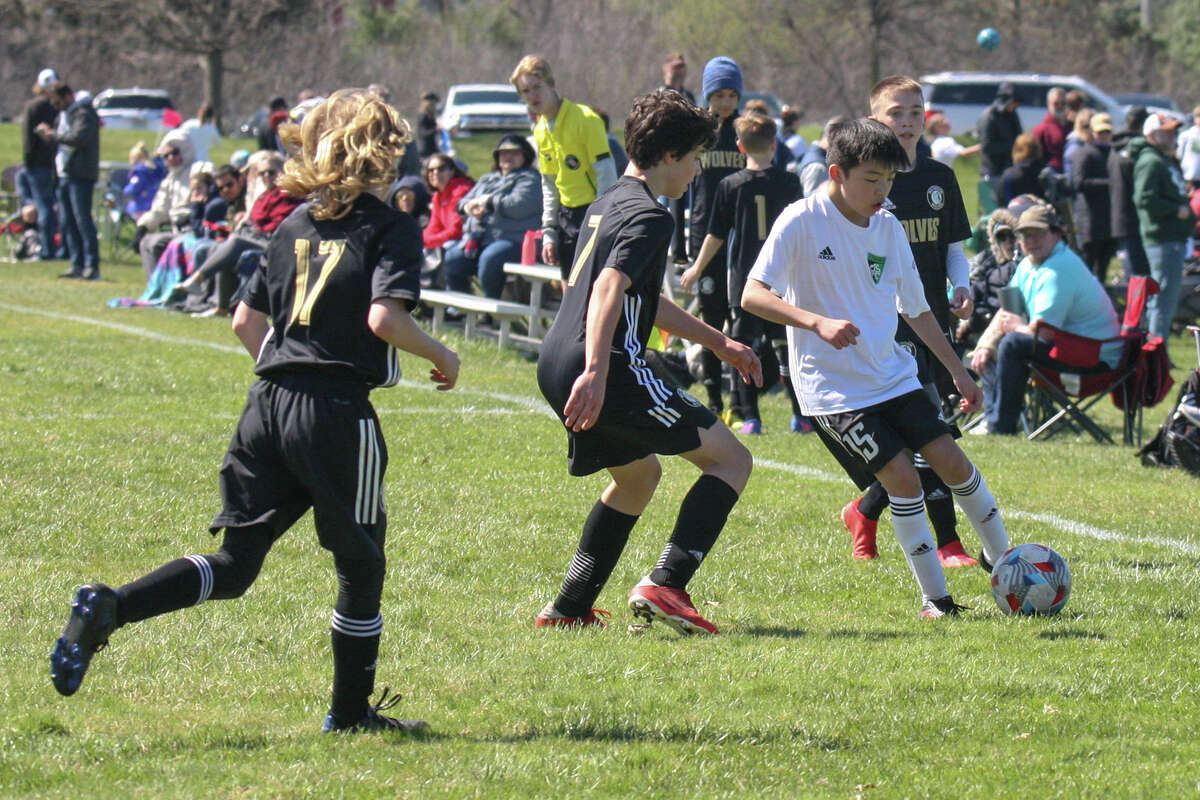 Midland Fusion's Nathan Song dribbles the ball while playing in the 39th annual Midland Invitational Tournament Saturday, May 9, 2022 at the Midland Soccer Club.