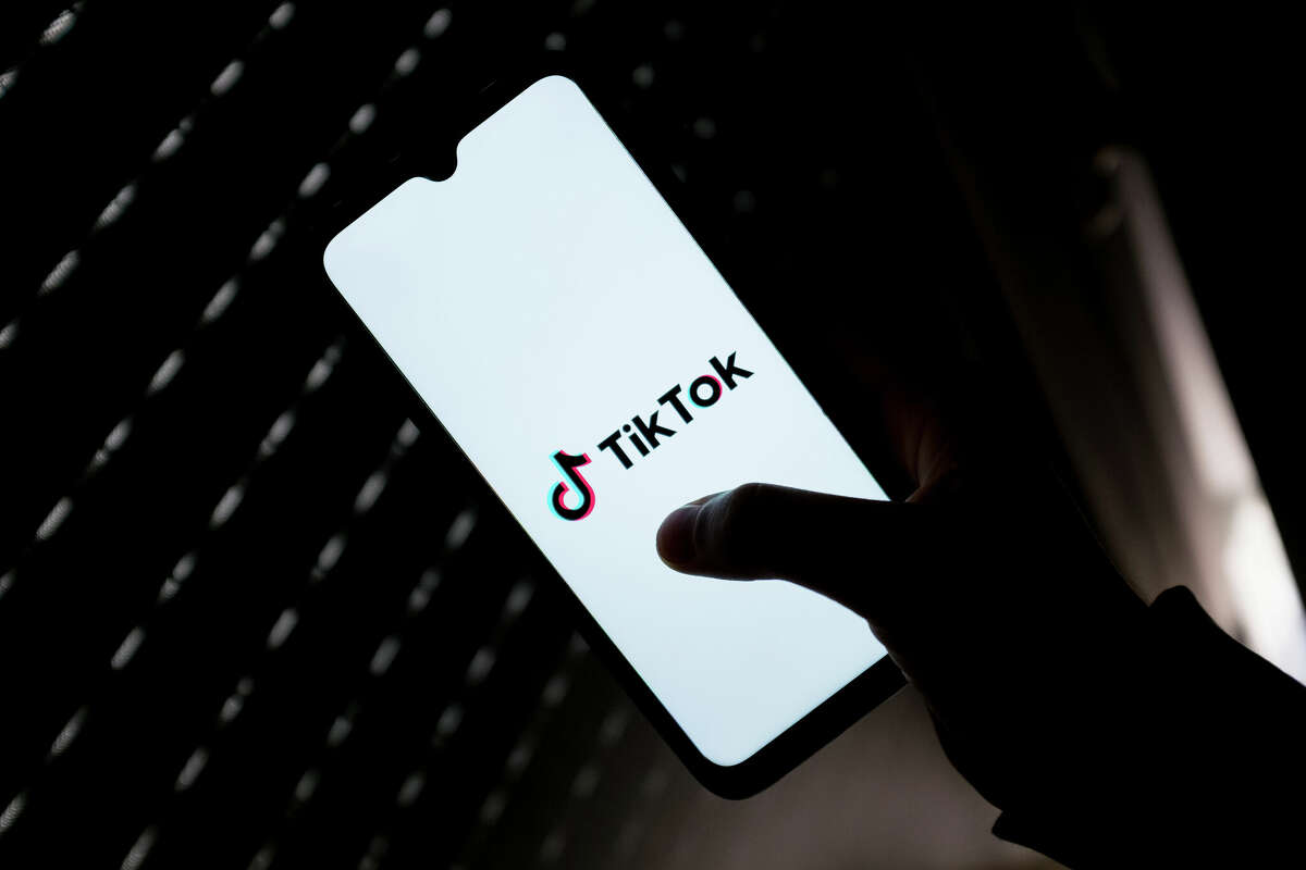 In this photo illustration a TikTok logo seen displayed on a smartphone screen. Police in Cibolo are warning people that if they shoot someone with a splat gun, they could be arrested.