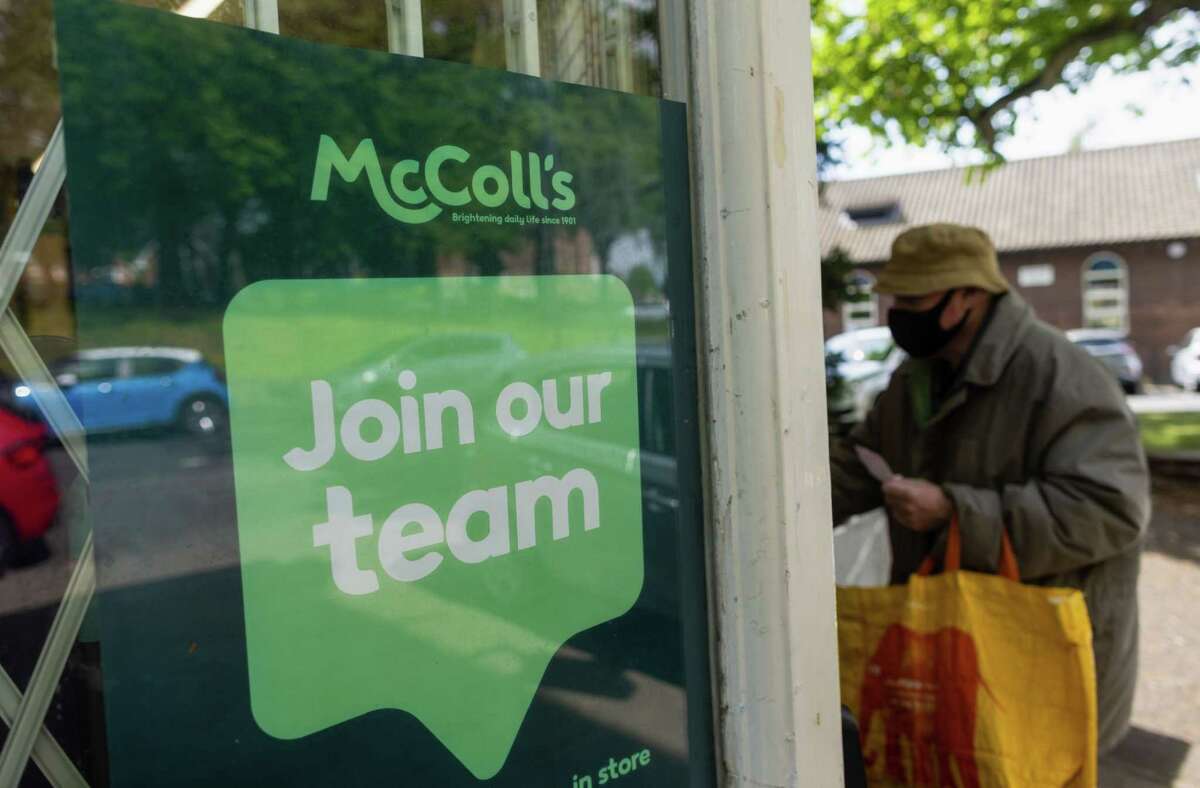 A McColl's recruitment sign is seen at a Martin's newsagent store, operated by McColl's, in Birmingham, U.K., on May 6, 2022.
