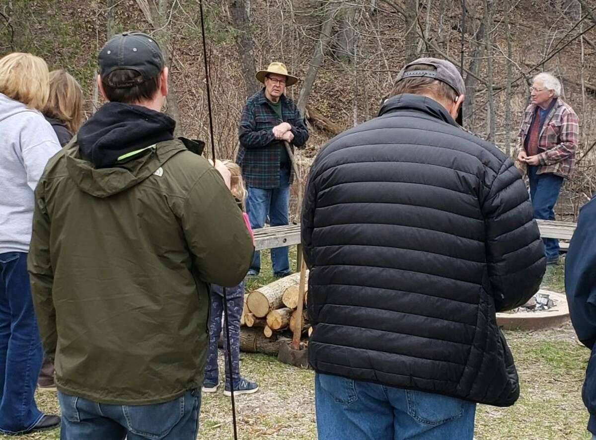 Gene Lagerquist, Spirit of the Woods Conservation Club president, discusses during a blessing of the fishing rods event on April 22 a project to protect wood turtle nests from predators such as raccoons and skunks.